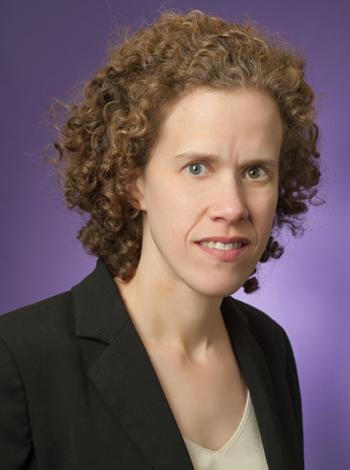 Headshot of Anne Frey in front of a purple background.