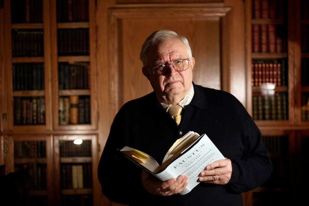 Color photograph of Frederick Burwick holding an open book.