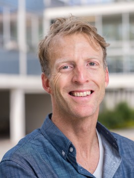 Color headshot of Bo Earle in a blue collared shirt.