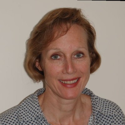 Color headshot of Carol Bolton in a collared shirt. 