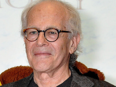 Color headshot of Charles North wearing glasses.