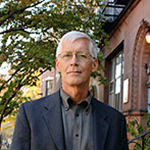 Color photograph of Charles Rzepka in a dark jacket and grey shirt.