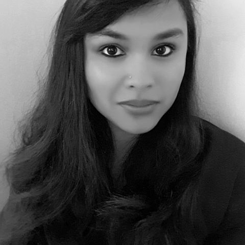 Black and white headshot of Ashley Caranto Morford.