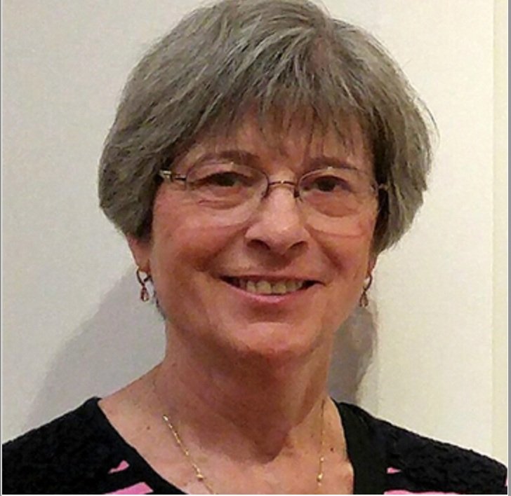 Color headshot of Beth Lau wearing glasses.