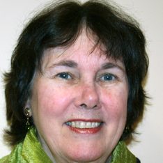 Color photo of Anne Mellor in a green shirt.