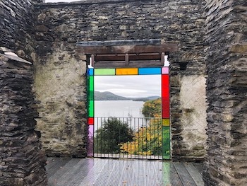 Figure 20: View from Claife Station. This structure, recently restored by the National Trust, 
                                was built in the 1790s on the site of one of Thomas West’s popular Windermere viewpoints and remained 
                                fashionable well into the nineteenth century. Its drawing room windows featured colored glass that 
                                could mimic the effects of different times of day and seasons of the year. Wordsworth mentioned this 
                                “Pleasure-house of the Station” in the Guide 
                                (para. 
                                    11). (Photo: Paul Westover, 2018)