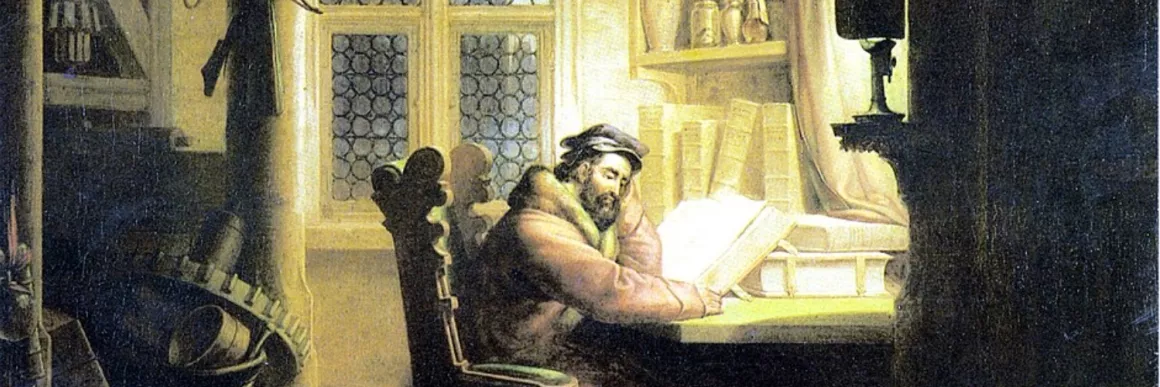 Man at his desk in gothic study