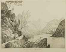 woman and child walking on trail along water
